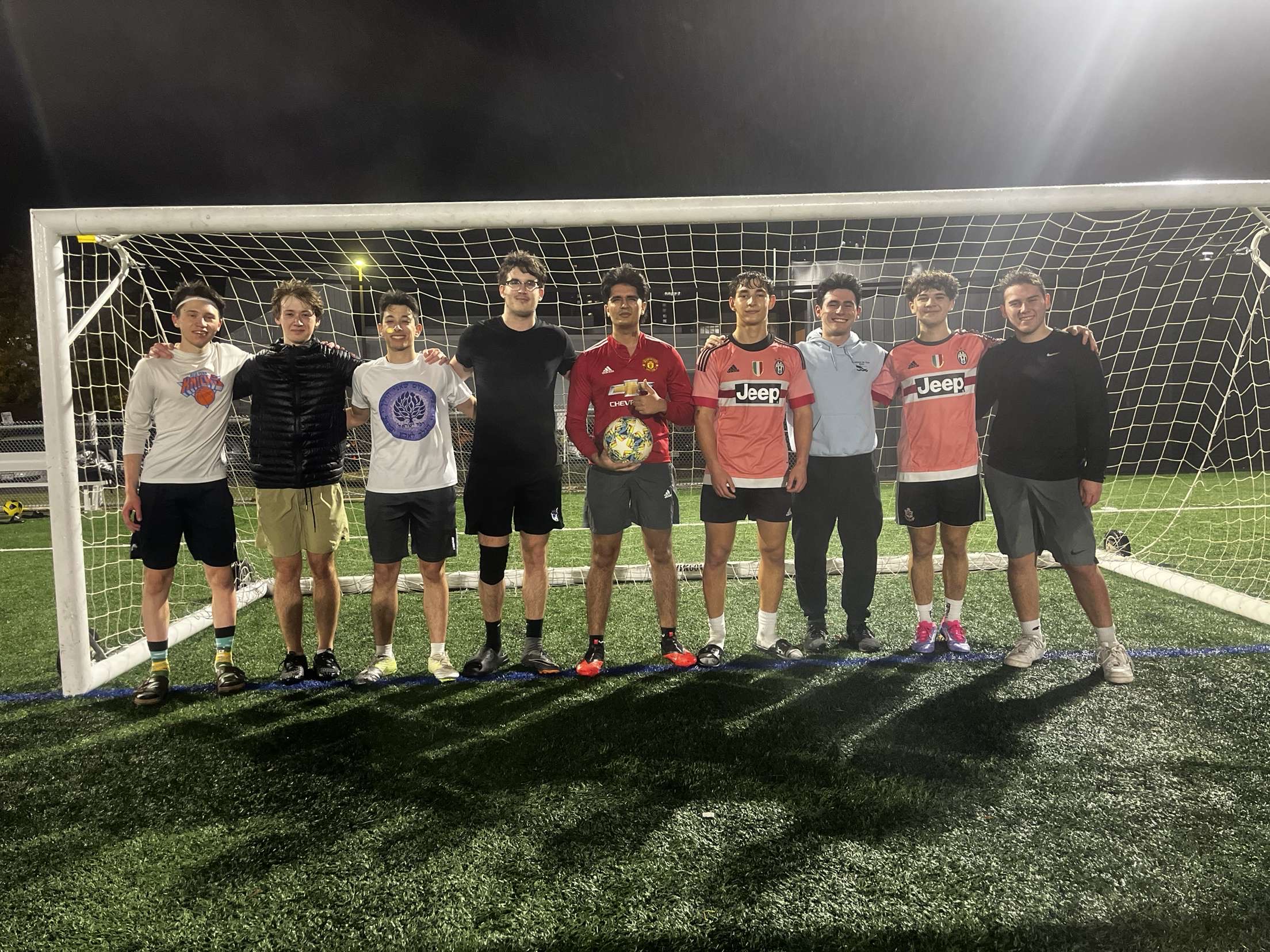 Footy Friends staff standing together on a soccer field